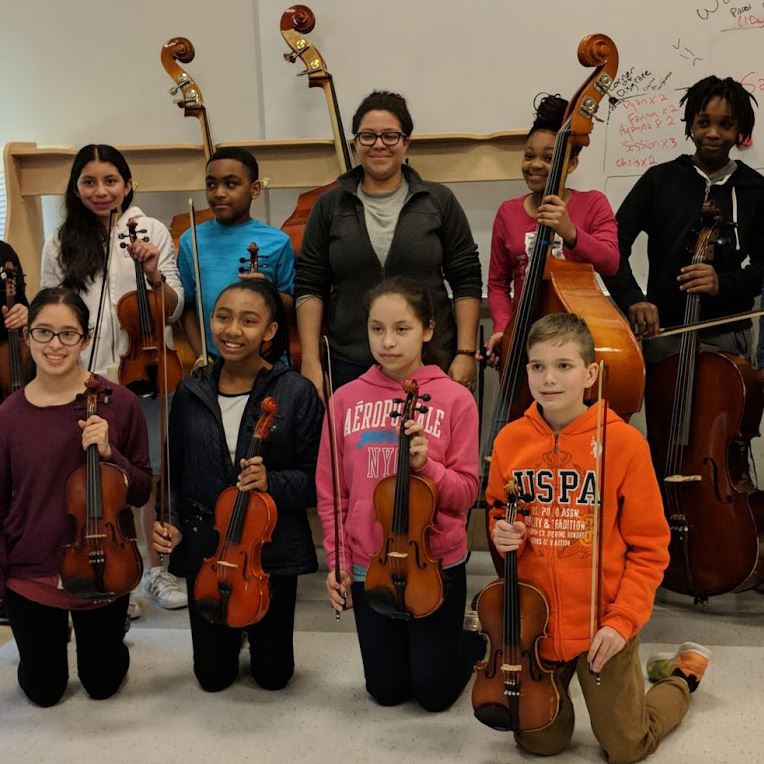  Teacher with students and instruments